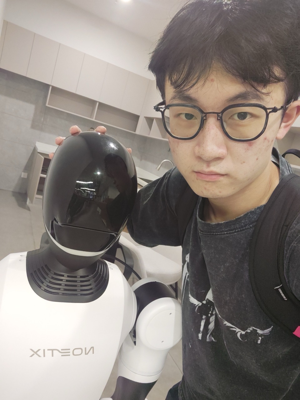 Jingbo Wang with a robot